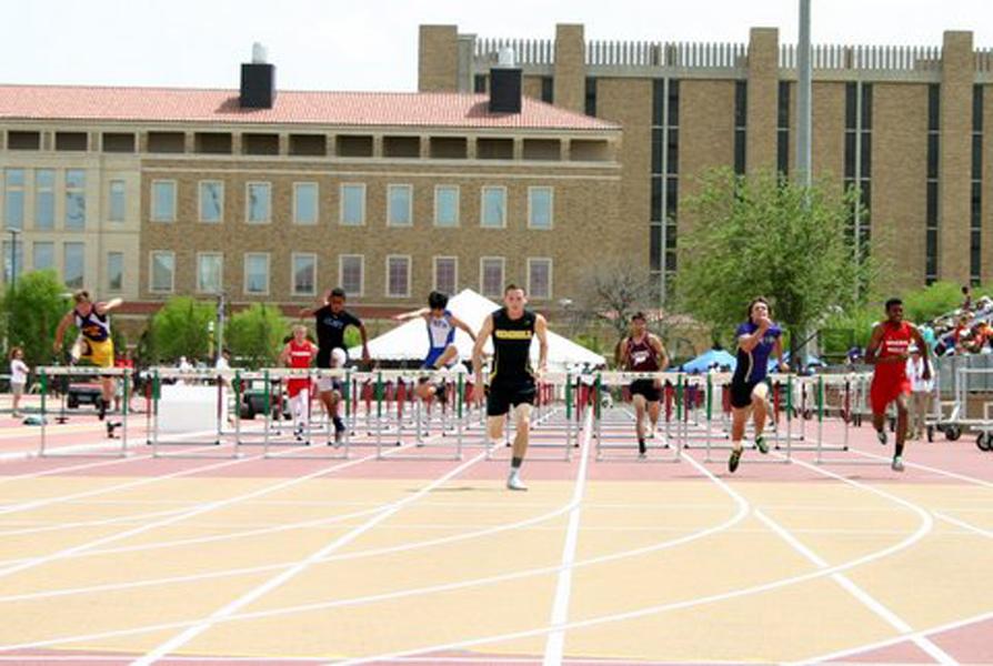Golden+boy--%0ASenior+Trevor+Greenfield+sales+to+the+finish+in+front+of+the+pack+in+his+preliminary+heat+of+the+110-meter+hurdles+at+the+regional+meet+at+Texas+Tech+on+April+25.+Greenfield+would+go+on+to+win+the+finals+in+both+the+110+hurdles+and+the+300+hurdles.
