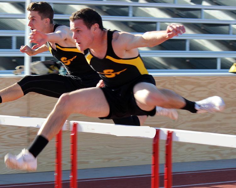 Chasing the record--
Senior Trevor Greenfield runs the 100 hurdle race at Denver City on March 28. Greenfield broke the school record in the event at area competition in Lubbock on April 16.