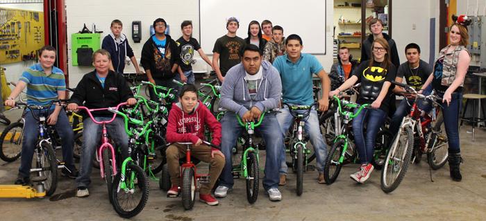 Ready for Santa--
Auto tech students show off the bicycles they refurbished for area children. The classes work on the service project every Christmas season.