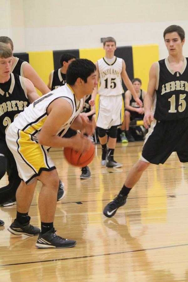 Running the offense
Freshman Ezekiel Grado looks for a teammate during district play against Andrews on Jan. 20. The Indians fell to