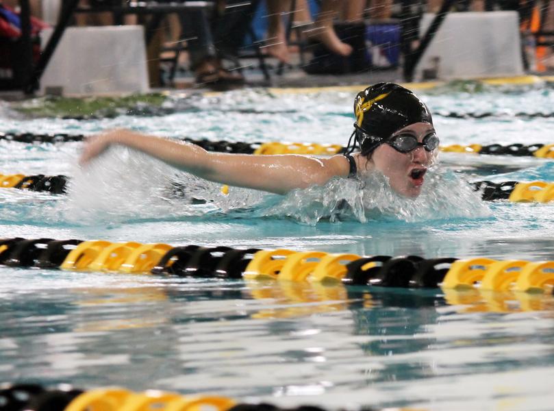 Taking wing
Junior Madi Werner skims the water in her heat of the 100-yard butterfly during competition at the Andrews invitational on Feb. 9-10. Werner took fifth place in a time of 1:17.32.