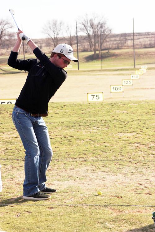 Driving practice--
Senior Alec Winfrey takes practice swings at the driving range during after school golf on Feb. 5. Winfrey took fourth place as the Indians won the Monahans meet on Feb. 7.