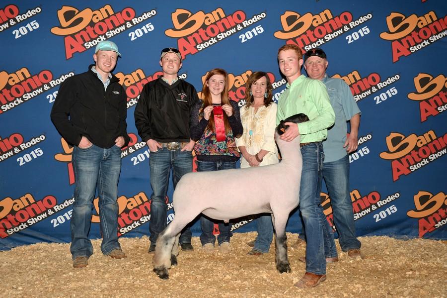Second+place--%0AFFA+senior+Alec+Winfrey+shows+his+award-winning+lamb+at+the+San+Antonio+stock+show.+Winfrey+is+accompanied+by+his+parents%2C+siblings+and+FFA+sponsor+Ryan+Best.