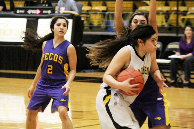 Outta my way--
Junior Jennyfer Gasca makes her way to the basket through Pecos players on Feb. 10. The Maidens took out the Lady Eagles, 42-12.