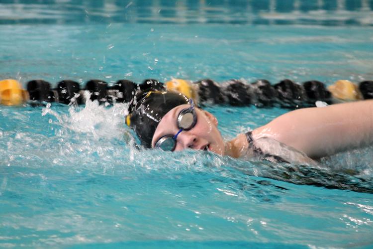 Warming up--
Sophomore Faith Klassen takes laps in the warm-up pool at the Andrews pool on Feb. 7 at the regional meet. Klassen, senior Arin Hindman, sophomore Madi Werner and senior Esther Neufeld took fifth in the 200 freestyle relay at the regional meet.