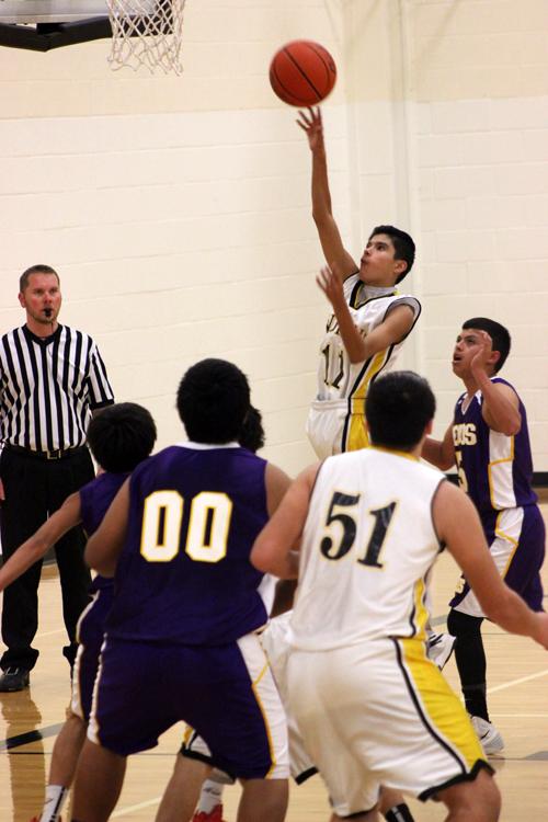 To the hoop--
Freshman guard Isaac Garcia puts the ball up during district play on Feb. 10. The Indians defeated Pecos, 38-21.