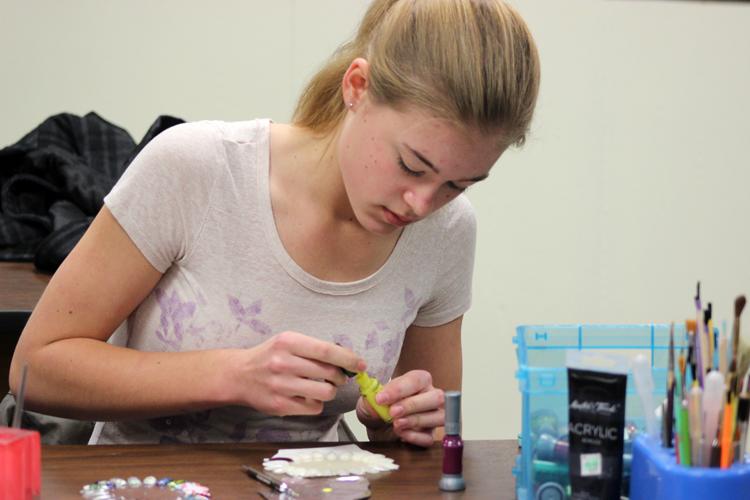 Nail practice--
SkillsUSA Cosmetology junior Judy Klassen practices nail art during class in January. Klassen took first place in nail art at the district meet on Feb. 7.