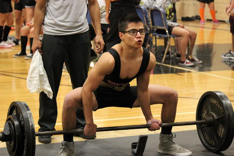 Weight gain--
Sophomore Peter Padilla deadlifts during the Seminole meet on Jan. 31. Padilla took second overall in the 114-pound class, lifting  335 pounds in deadlift and 820 pounds overall.