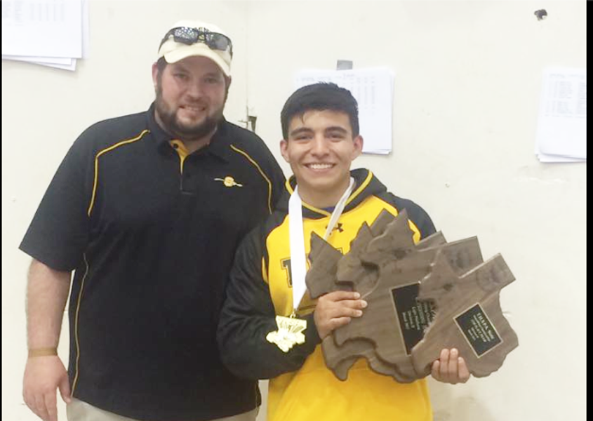 State record--
Coach Ty Palmer stands with state champion senior Andrew Alvidrez after he won on March 28 in Abilene. Alvidrez set the state record in his weight class.