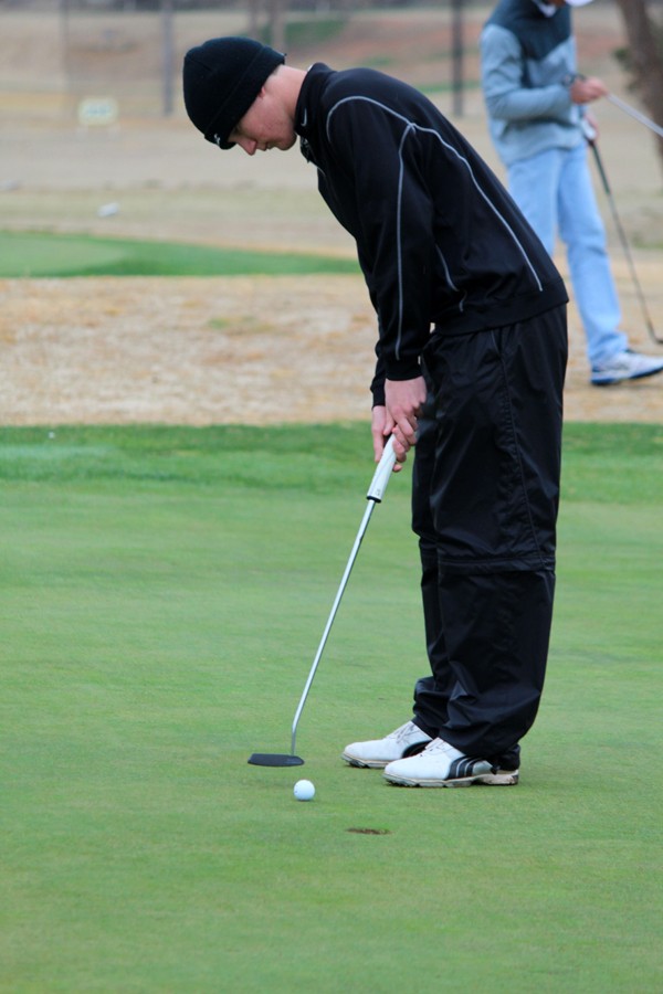 Short game--
Junior Luke Wimmer putts during the Seminole Invitational on March 20. Wimmer shot a 70 the second round of regional play on April 17 to advance to state.