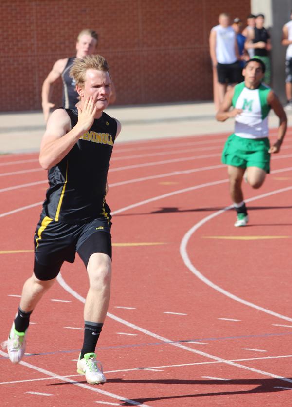 Making finals--
Sophomore Jarryd Karr takes the last curve in the 400-meter prelims at Mustang Stadium in Andrews on April 16. Karr qualified for finals finishing fourth in the district race which gave him a spot at the area meet on April 23 in Pecos.