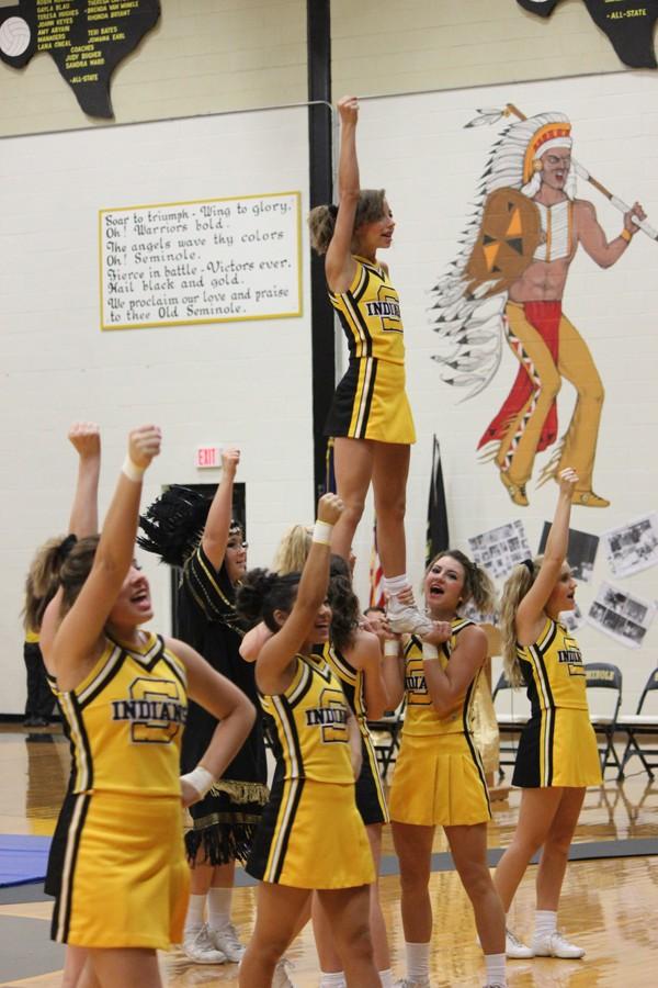 Cheer squad--Cheerleaders perform at the homecoming pep rally on Sept. 11.