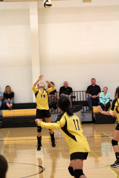 Setting it up--Freshman Wendy Contreras sets the ball for freshman Chelsea Viscaino during preseason play against Monterey on Sept. 15. The Maidens fell to Monterey in three games.
