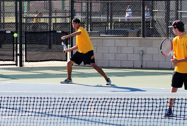 Double trouble--Junior Chris Owen makes a return to Pecoss Andy Lin and Jared Mondragon during district play on Sept. 26. Owen and doubles partner senior Royce Snethen took the match, 6-2, 6-3.