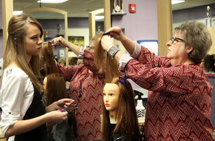 Final lessons
Cosmetology instructor Shelly Touchstone shows junior Martha Friesen a hair technique during fourth period on Nov. 5. Touchstone will retire at the end of the semester after working at Seminole High School for 25 years.