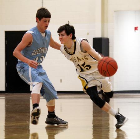 Driving in--
Freshman Cooper Logan makes his way around a Greenwood player on Feb. 2. The  Indians fell to the Rangers, 52-39.