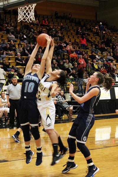 Not so fast--
Senior post Brittany Kelly rejects a Rangerette’s shot during district play on Feb. 2. The 52-35 win ensured the Maidens part of the district title if they win their last two district games.