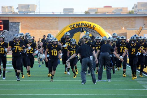 CAMARADERIE
The Indians run onto the field for the first game of the season versus Lubbock High on Aug. 26. The Indians defeated the Westerners, 49-9.