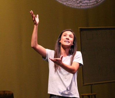 In the limelight--
Senior Lauren Franco performs for the audience as a warm-up act before the fall theater production of Fools on Oct. 24 in the Performing Arts Center.
