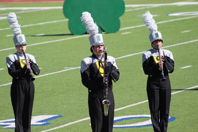 Lucky show--
Clarinets sophomoe Kaitlin Harrison, freshman Pancho Peters and sophomore Ruby Reyes perform during the first movement of the Luck o’ the Irish show at UIL Region Marching Contest on October 29 at Lowrey Field in Lubbock.