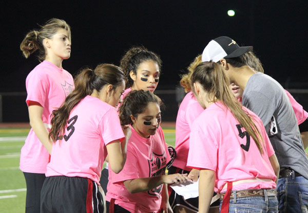 Strategy session--
Senior Scout Powers shows senior Jaynaerose Quisenberry the play during a timeout during the powder puff game on Nov. 4. The seniors took the win over the underclassmen, 18-12.