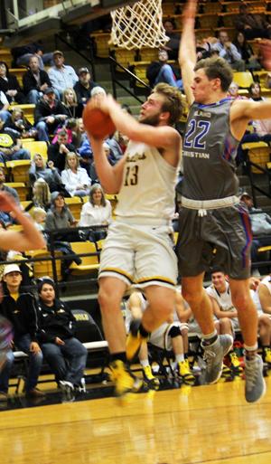 Take it to make it--
Junior point guard Cade Barnard is fouled by a Midland Christian player while shooting a layup during the home game on Dec. 13.
The Indians took the win, 57-49, over the Mustangs.