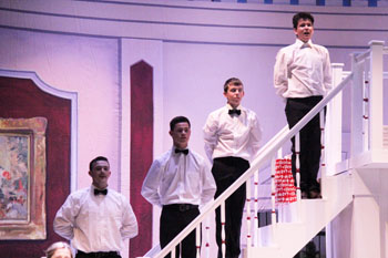 Butler brigade--
Sophomore Rusty Froese, junior Ransom Edwards, freshman Nathan Gates and sophomore Colter Robertson sing “Tomorrow” during the finale of the winter musical Annie on Jan. 16.