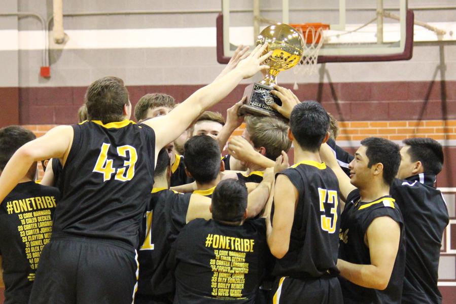 Area champs--
Indian basketball players take the area trophy on Feb. 24. They defeated Fort Stockton, 73-48.