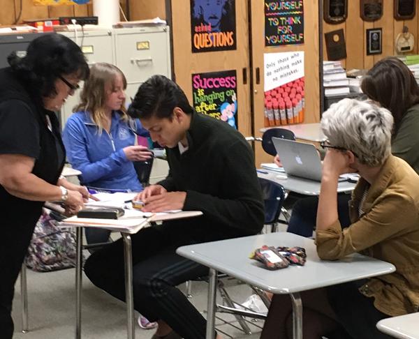 Last minute details--Math coach Gracie Sosa works with senior Hector Marquez as UIL competitors prepare for competition as Seminole hosts the district meet on March 22.
