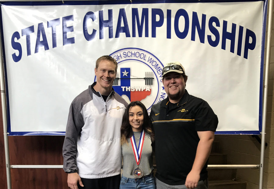 State+champ--%0ACoaches+Dustin+Rotan+and+Michael+Mann+pose+with+womens+state+powerlifting+champion+senior+Amanda+Rodriguez.+Rodriguez+took+first+in+the+105-pound+category+on+March+17+in+Waco.
