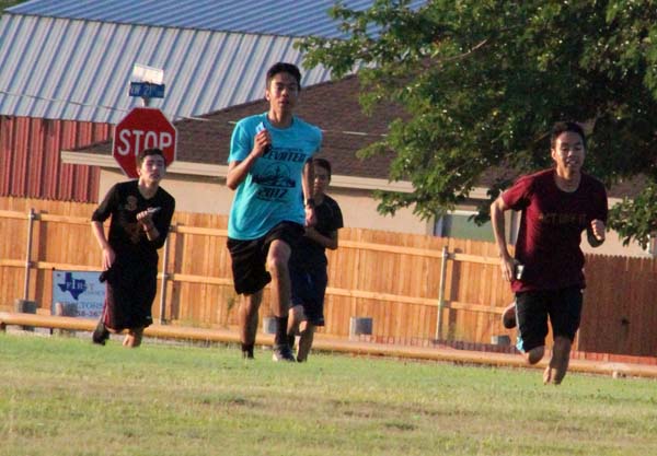 Getting in shape--
Senior Antonio Arreola Lechuga and brother junior Luis Arreola lead the pack of runners during summer workouts in August.