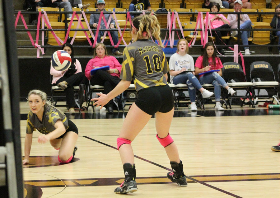 Just got it--
Senior setter Taylor Roberts gets a dig one-handed from the floor to junior outside hitter Mikenzie Stokes during district play against Levelland on Oct. 24. The Maidens defeated the Loboettes in four to take an undefeated district championship. wi