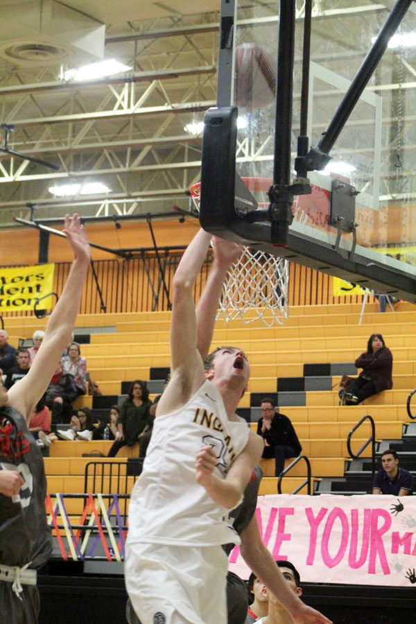 Putting it up--
Senior forward Clayton Medlin shoots  a layup during the Indian season opener versus Cooper on Nov. 14. The Indians fell 58-51 to the Pirates.