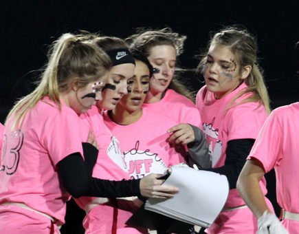 Senior strategy
Seniors Juliet Rempel, Peighton Andrews, Logan Jaquez, Delainee Neal and Kylee Seay pore over the offense binder provided by the senior coaches, which unfortunately got thrown back to them and came flying apart several times during the game. “We had a little misscommunication over the notebooks,” Coach Bryce Karr said. 