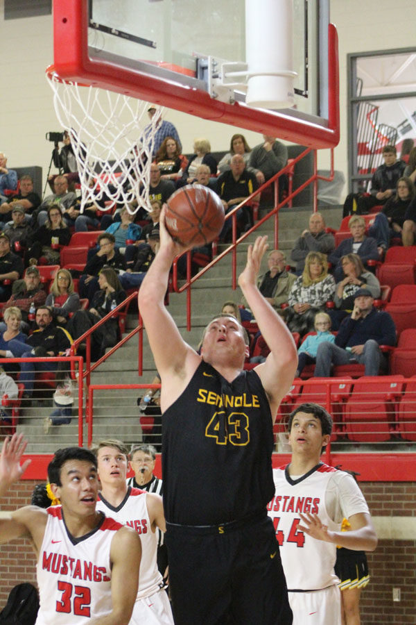 Dominance down under--
Senior post Reese Moore goes up for two of his 19 points against Denver City on Jan. 30. The Indians defeated the Mustangs,  56-49.