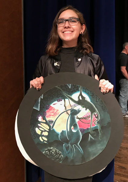 Statebound--Junior Shyan Lujan shows her winning painting on Feb. 17 at Frenship High School. Her work was called Stop to Taste Something New.