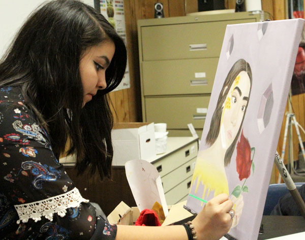 Artists touch--Junior Abigail Avitia Lopez works on her painting for VASE during fourth period on Jan. 30. Lopez is entering VASE for the first time.