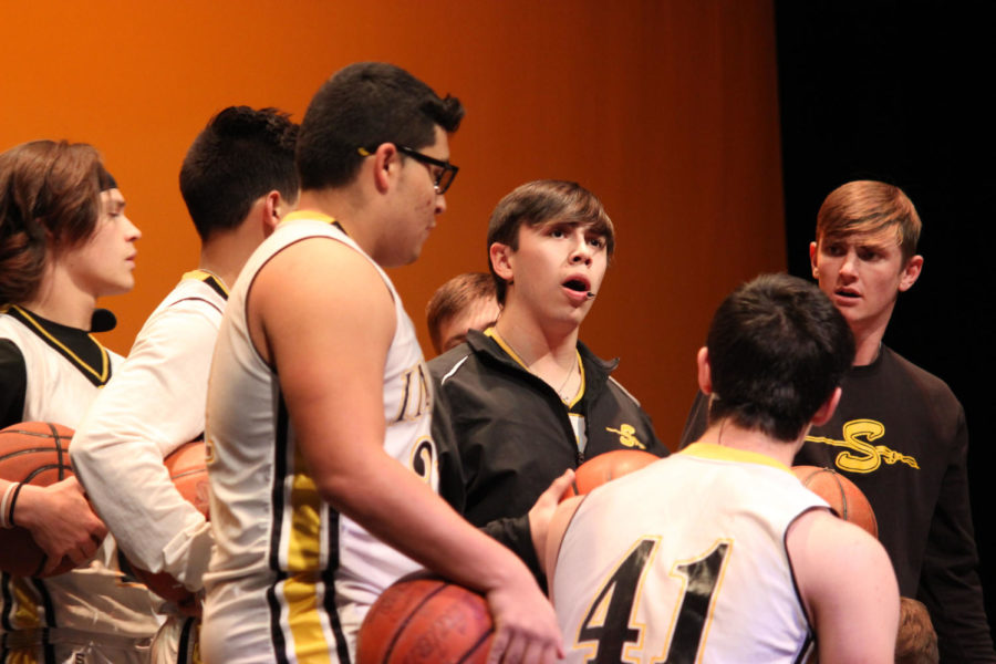 Team tune--
Senior Alex Gonzalez leads his basketball team in a song during the Jan. 20 production of High School Musical. Gonzalez played the lead, Troy Bolton.