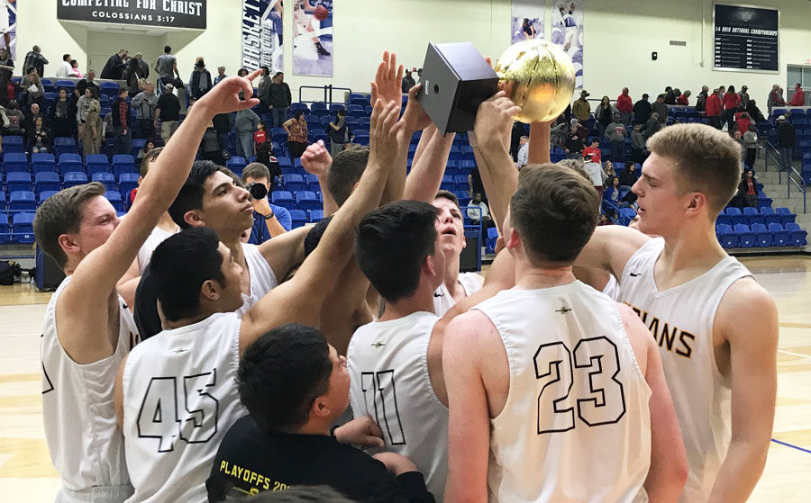 Medal+collection--Indian+basketball+players+hoist+the+trophy+in+the+air+after+winning+the+region+quarterfinal+over+Levelland%2C+61-46%2C+on+Feb.+27.+The+Indians+will+face+Midlothian+Heritage+in+the+region+semifinal+on+March+2.