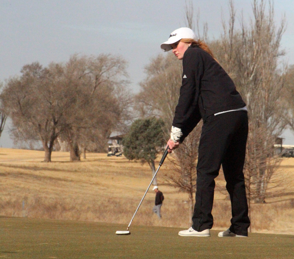 Leading the pack--Senior Juliana Klassen chips during play at the Seminole invitational on March 8. The Maidens took first in the meet.