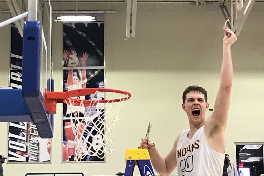 Statebound--Senior+guard+Carter+Laramore+takes+the+first+snip+at+the+net+after+the+Indians+defeated+the+Wylie+Bulldogs%2C+62-42+in+the+Region+1+final+on+March+3.+The+Indians+will+face+Dallas+Carter+in+the+state+semifinals+on+March+9+in+the+Alamodome.