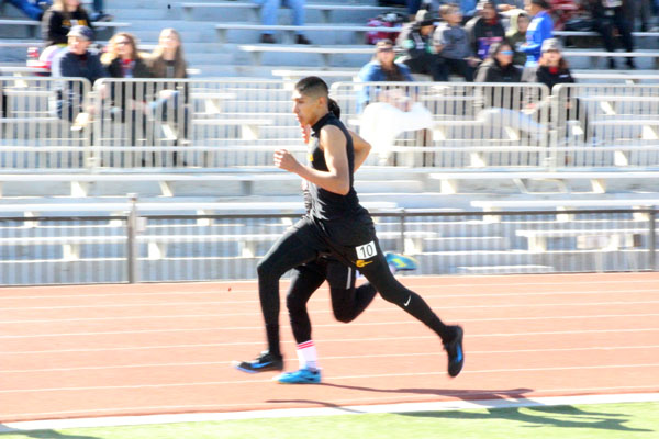 Passing+speed--Sophomore+Mario+Hernandez+sprints+the+home+stretch+of+the+800-meter+run+at+district+on+April+7.+Hernandez+qualified+for+area+in+third+place+with+a+time+of+2%3A08.11.