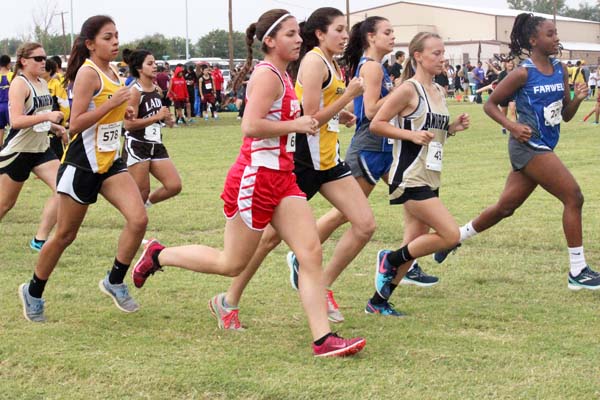 Getting started--
Sophomore Azalia Contreras and senior Leyla Trevino run the first stretch of the Sundown race on Sept. 29. Contreras finished 31st and Trevino was 66th in 137-runner contest.