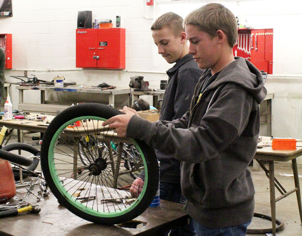 Bikes for tikes--
Auto Tech SkillsUSA sophomores Joey Giesbrecht and James Giesbrecht refurbish used bicycles for underprivileged children during fifth period.