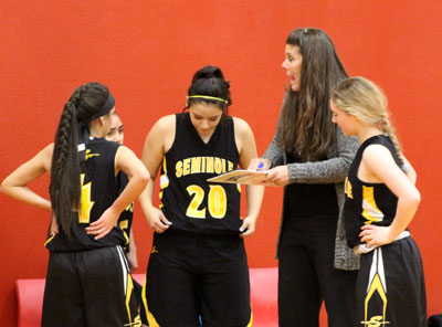 Look at this--
Freshman Maiden Coach Shannon Caffey diagrams a play for her team during the Dec. 11 loss to Levelland.