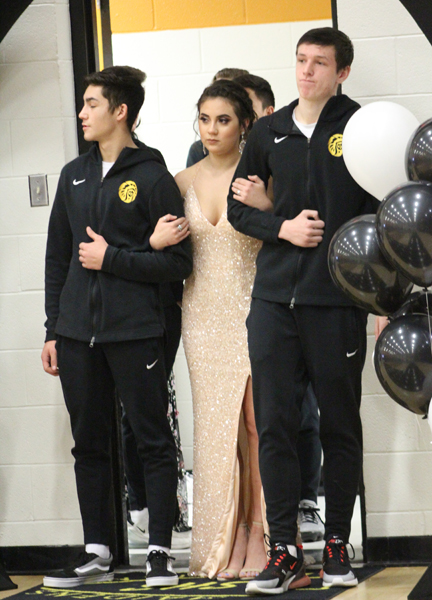 Sophomore representative--
Sophomore Aleigh Verdusco is escorted by sophomore River Powers and sophomore Caden Cottrell.