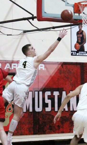 MVP move--
Senior forward Jalen Brattain goes up for a basket against Levelland in the area championship on Feb. 22. Brattain was named MVP of District 2-4A by district coaches.