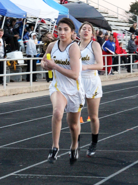 Hand off--
Freshman Xyla Madry gives the baton to senior Chloe Gonzalez during the 800-meter relay at the Lamesa track meet on Feb. 28. The relay team took third in a time of 1:56.89.