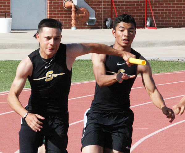 Hurried+hand+off--%0ASophomore+Damion+Espino+hands+the+baton+to+sophomore+Sergio+Soto+who+anchors+the+sprint+relay+at+the+district+meet+in+Andrews+on+April+4.+The+team%2C+which+qualified+for+area+in+third+place%2C+included+sophomore+Jason+Mejia+and+sophomore+Makii+Bates.
