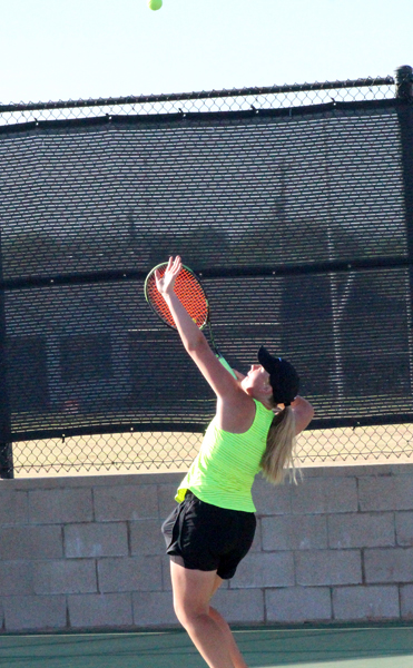 Serving for regionals--
Junior Julie Enns serves during the district tie breaker in mixed doubles on April 10. Enns and partner sophomore David Wiebe defeated  a Monahans team to get second and advance to region.